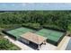 Aerial view of community pickleball courts and covered seating at 17626 Gawthrop Dr # 201, Bradenton, FL 34211