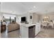 Modern kitchen with island, stainless steel appliances, and white cabinets at 17626 Gawthrop Dr # 201, Bradenton, FL 34211