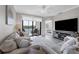 Bright living room with access to a balcony and a view of the lake at 17626 Gawthrop Dr # 201, Bradenton, FL 34211