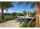Landscaped pathway leading to tennis courts and a pavilion at 17626 Gawthrop Dr # 201, Bradenton, FL 34211