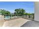 Spacious tiled balcony with glass railings, offering serene outdoor views and space for relaxation at 2038 Datura St, Sarasota, FL 34239