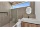 Modern bathroom with a glass shower enclosure and stylish vanity at 2038 Datura St, Sarasota, FL 34239