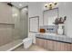 Modern bathroom with a glass-enclosed shower, sleek fixtures, marble vanity, and a contemporary design at 2038 Datura St, Sarasota, FL 34239