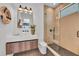 Modern bathroom featuring a glass-enclosed shower and a floating vanity at 2038 Datura St, Sarasota, FL 34239