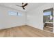 Spacious bedroom with light wood floors and an ensuite bathroom at 2038 Datura St, Sarasota, FL 34239