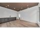 Bonus room with a bar and light wood floors. Perfect for entertaining at 2038 Datura St, Sarasota, FL 34239
