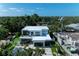 Aerial shot of modern home with sleek design, lush landscaping, and ample parking at 2038 Datura St, Sarasota, FL 34239