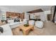 Open-concept living area with modern furnishings, stylish lighting, and seamless access to dining and kitchen at 2038 Datura St, Sarasota, FL 34239