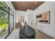 Office space features a large window, geometric light fixtures, and decorative vases at 2038 Datura St, Sarasota, FL 34239