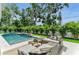 Inviting outdoor pool area featuring an outdoor seating and dining area, perfect for outdoor entertaining at 2038 Datura St, Sarasota, FL 34239