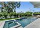 Inviting backyard pool and spa area with lush landscaping and stylish accents at 2038 Datura St, Sarasota, FL 34239