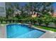 Sparkling pool and spa with beautiful landscaping and modern design at 2038 Datura St, Sarasota, FL 34239