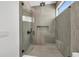 Sleek shower featuring unique tilework, glass enclosure and modern fixtures at 2038 Datura St, Sarasota, FL 34239