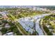 Aerial view showing townhomes, a community pool, and nearby city skyline at 2344 Lindstrom St, Sarasota, FL 34237