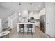 Modern kitchen with white cabinets and stainless steel appliances at 2344 Lindstrom St, Sarasota, FL 34237