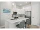 Modern kitchen featuring stainless steel appliances and an island at 2344 Lindstrom St, Sarasota, FL 34237