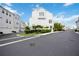 White two-story home with fenced backyard at 2344 Lindstrom St, Sarasota, FL 34237