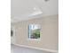 Bright living room with large window and tile floors at 2814 Daphne Rd, North Port, FL 34288