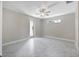 Spacious bedroom with tile floors and sliding glass door to patio at 2814 Daphne Rd, North Port, FL 34288