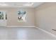 Bright living room with tile floors and view of backyard at 2814 Daphne Rd, North Port, FL 34288