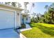 New construction home with a modern garage and walkway at 2814 Daphne Rd, North Port, FL 34288