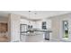 Modern kitchen with island and stainless steel appliances at 2814 Daphne Rd, North Port, FL 34288