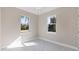 Bright bedroom with two windows and tile floors at 2814 Daphne Rd, North Port, FL 34288