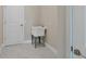 Bright laundry room with utility sink and modern flooring at 2814 Daphne Rd, North Port, FL 34288