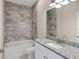 Bathroom with granite countertop and shower/tub combo at 2814 Daphne Rd, North Port, FL 34288