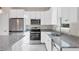 Modern kitchen with granite countertops and stainless steel appliances at 2814 Daphne Rd, North Port, FL 34288