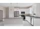 Modern kitchen with granite countertops and white cabinets at 2814 Daphne Rd, North Port, FL 34288