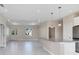 Open concept living area with tile floors and kitchen island at 2814 Daphne Rd, North Port, FL 34288