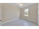Well-lit bedroom with ceiling fan and tile floors at 2814 Daphne Rd, North Port, FL 34288