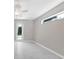 Bright bedroom with tile floors and large window at 2814 Daphne Rd, North Port, FL 34288