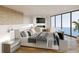 Serene main bedroom featuring a luxurious bed, fireplace, television, and breathtaking ocean views at 3200 Higel Ave, Sarasota, FL 34242