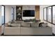 Relaxing living room with a large comfortable sofa, built-in shelving, and hardwood floors at 3200 Higel Ave, Sarasota, FL 34242