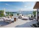 Enjoy panoramic water views from this roof deck with dining, lounging, and a fire pit at 3200 Higel Ave, Sarasota, FL 34242