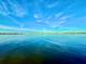 Scenic waterfront view showcasing serene blue water and picturesque skyline, perfect for tranquil living at 3200 Higel Ave, Sarasota, FL 34242