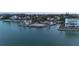 A serene waterfront property with clear blue water, offering picturesque views and luxurious living at 3200 Higel Ave, Sarasota, FL 34242