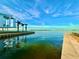 Modern home with a beautiful waterfront view and palm trees at 3200 Higel Ave, Sarasota, FL 34242