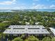 Beautiful aerial view of the property showcasing lush landscaping and nearby waterway at 3700 S Osprey Ave # 214, Sarasota, FL 34239