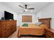 Spacious bedroom with wood floors and ceiling fan at 3700 S Osprey Ave # 214, Sarasota, FL 34239