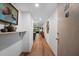 Inviting hallway featuring modern decor, wood-look flooring, and seamless transition to living spaces at 3700 S Osprey Ave # 214, Sarasota, FL 34239