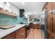 Updated kitchen features stainless appliances, quartz counters and open access to the living area at 3700 S Osprey Ave # 214, Sarasota, FL 34239