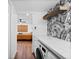 Modern laundry room with appliances and storage at 3700 S Osprey Ave # 214, Sarasota, FL 34239
