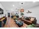 Open living room features a modern kitchen and a leather sofa at 3700 S Osprey Ave # 214, Sarasota, FL 34239