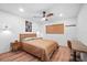 Bright bedroom with wood floors and a modern dresser at 3700 S Osprey Ave # 214, Sarasota, FL 34239