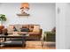 Living room with leather sofa and green accent chair at 3700 S Osprey Ave # 214, Sarasota, FL 34239