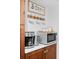 Coffee bar with microwave, coffee maker and tea kettle at 3700 S Osprey Ave # 214, Sarasota, FL 34239