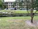 Peaceful view of a canal with ducks and lush landscaping at 390 301 W Blvd # 27B, Bradenton, FL 34205